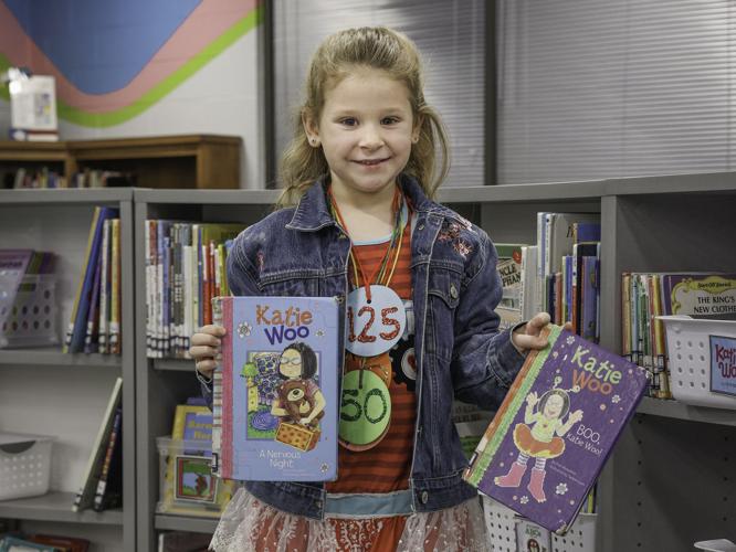 Sweeny first-grader accepts dad's challenge to read 200 books ...