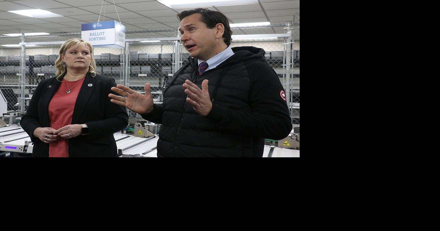 Cari-Ann Burgess, interim registrar of voters, and Nevada Secretary of State Francisco “Cisco” Aguilar speak with reporters and concerned citizens about the upcoming elections in Reno on Jan. 23, 2024.