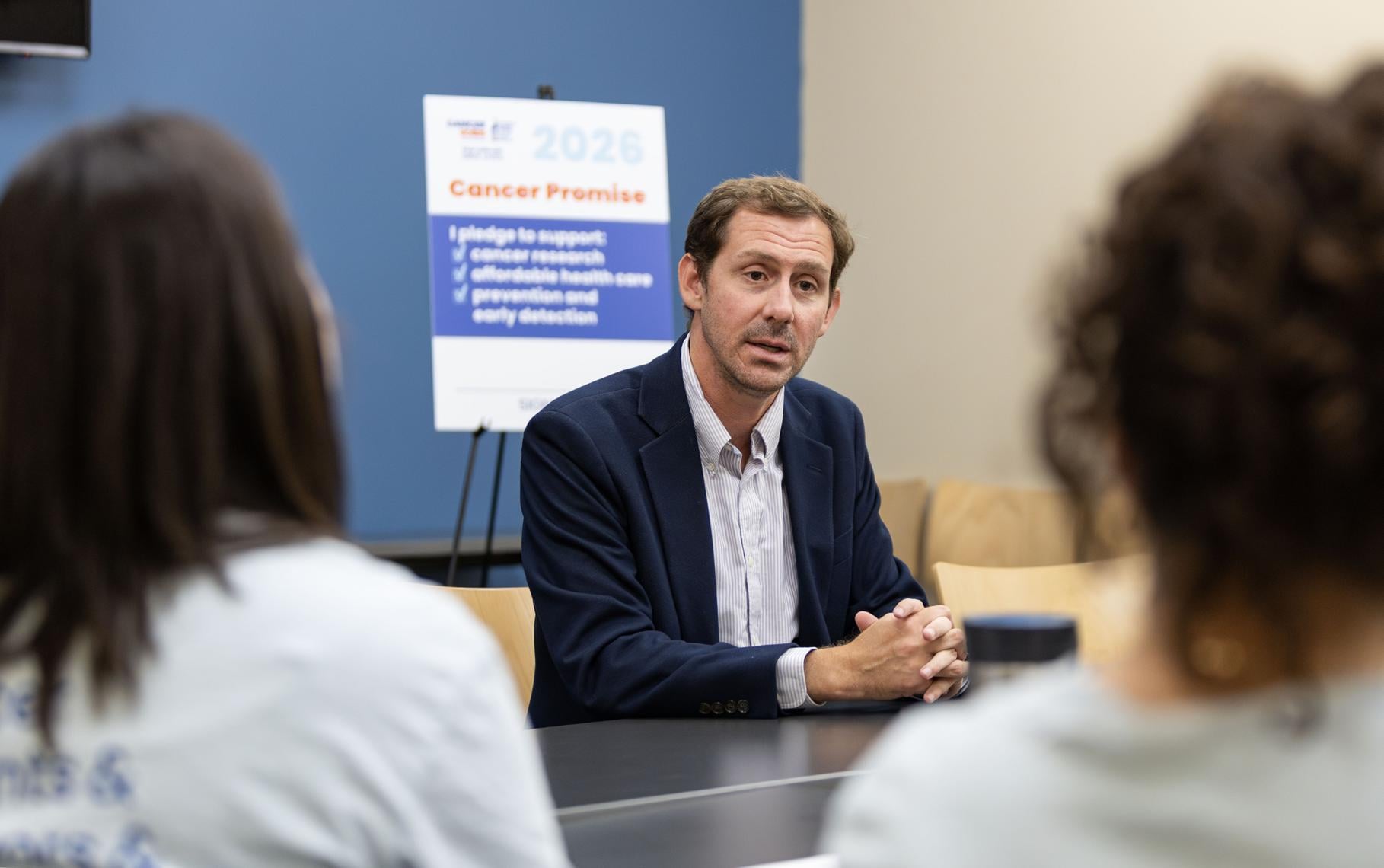 Michael Bridgford speaks with members of the American Cancer Society Cancer Action Network at the Iowa City Public Library