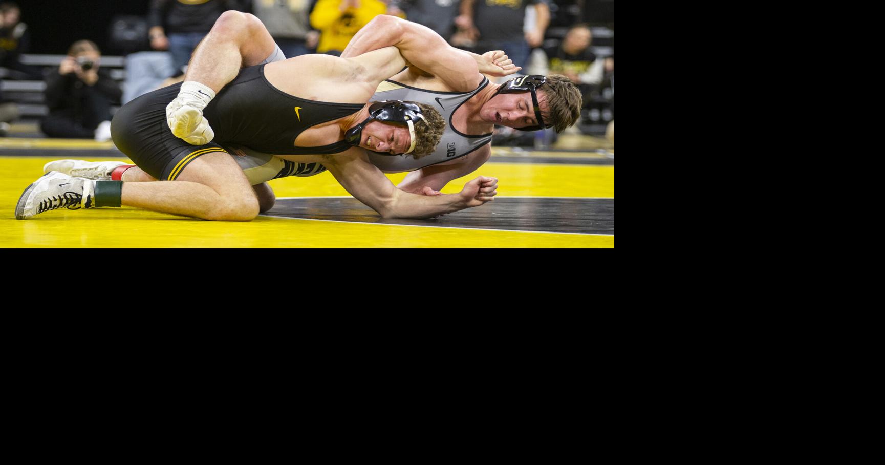 Iowa wrestler Aiden Riggins is undeterred as he searches for his first ...