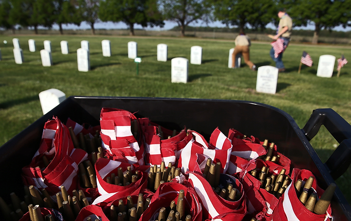 Marlborough scouts place flags on veterans' graves