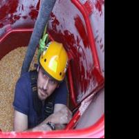 Firefighters learn how to rescue someone buried in grain