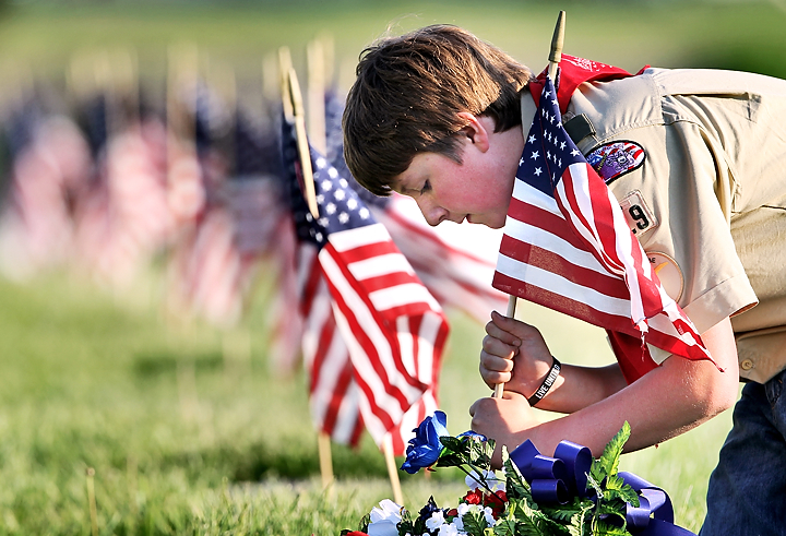 Marlborough scouts place flags on veterans' graves