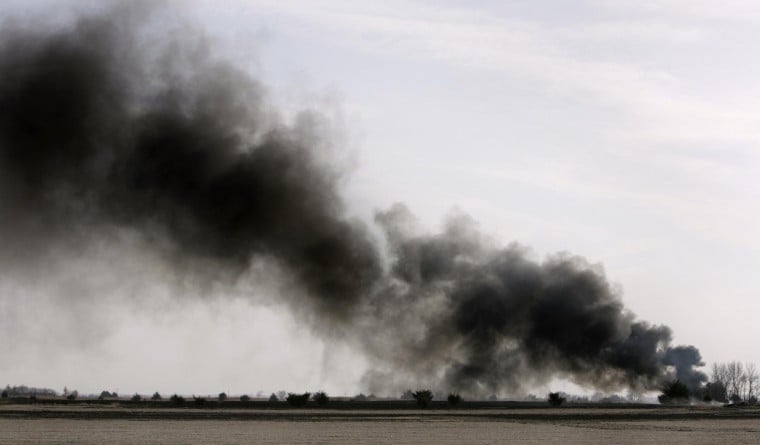 Wind whips controlled burn