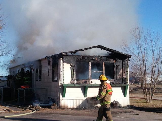 Fire destroys trailer; one person taken to hospital