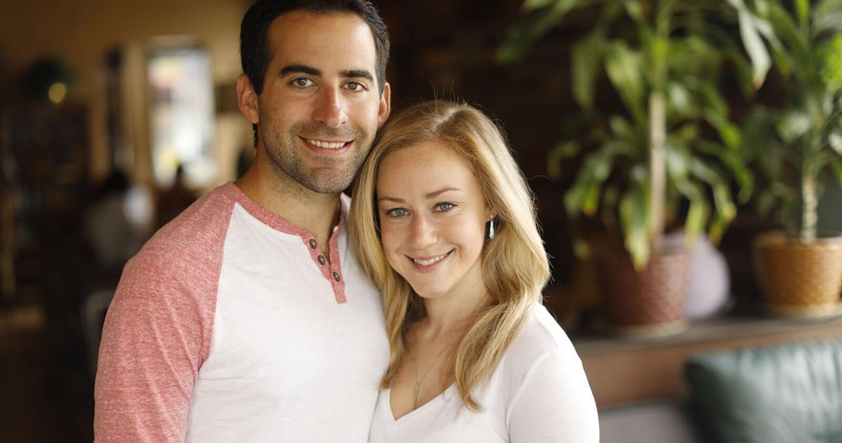 Erica Brecher and Andrew Baglini of WIVB welcome a new Bills' fan