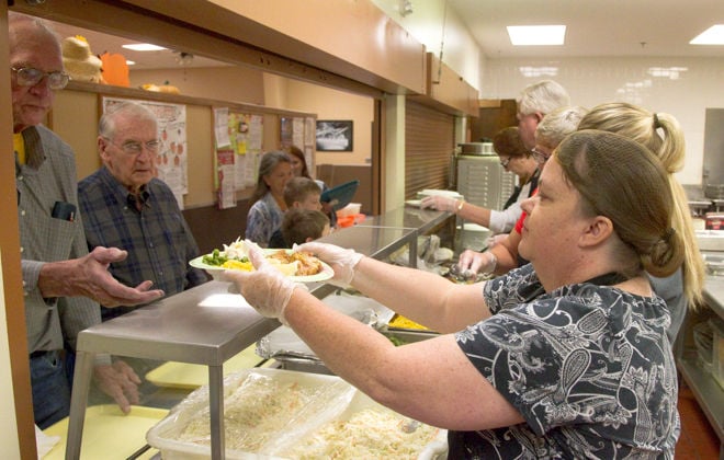 16 years and counting for harvest festival to fight local hunger wanda winder serves a plate of food sunday at the grand generation center during project hunger s harvest festival fundraiser chicken and pheasant were the