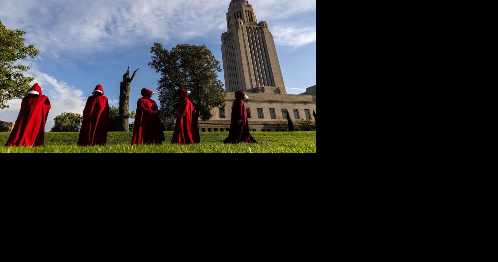 Silent handmaids in red unsettle Nebraska’s top Republicans