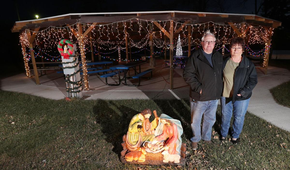mr and mrs claus put up the christmas lights local news