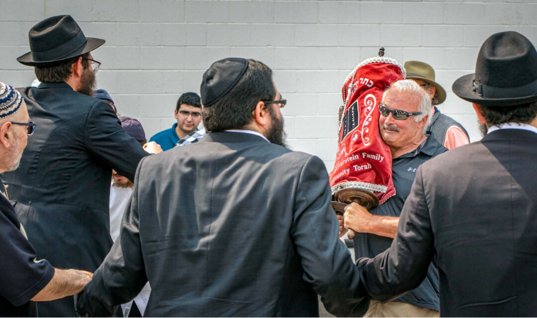 Jewish community center celebrates dedication of its first Torah scroll