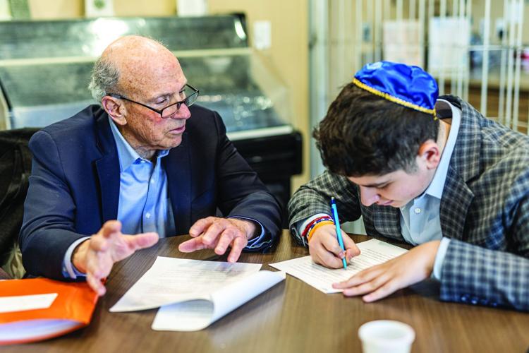 FJA student Zeev Maine takes notes while interviewing Michael Maddin.jpg