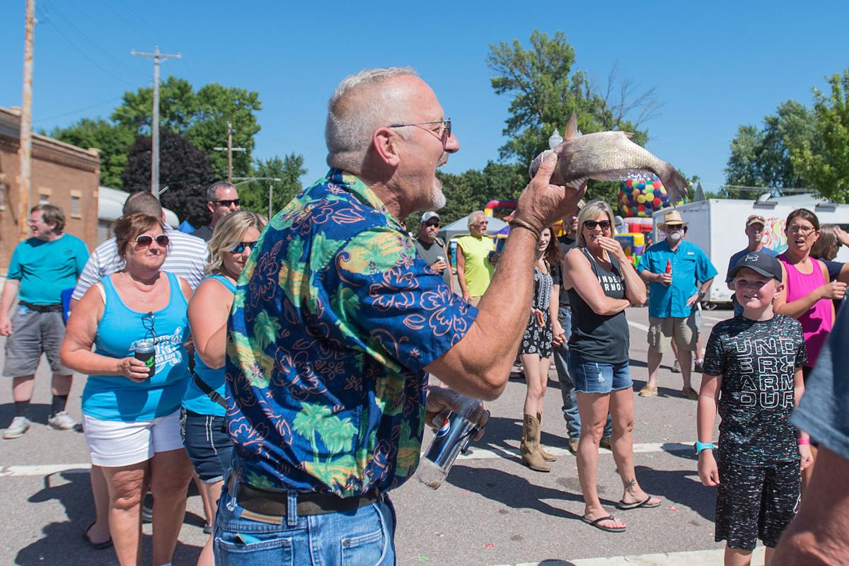 ‘Stinky, slimy’ kiss a fish tradition lives on in Madison