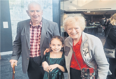 Ella Kate poses with grandparents Lawrence and Patti Mattingly.