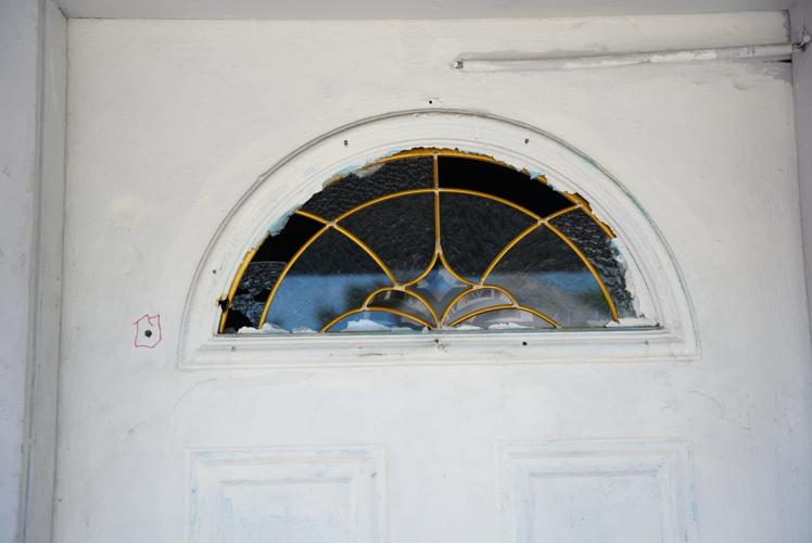 Woman killed by stray bullet while holding grandchild in home | News ...