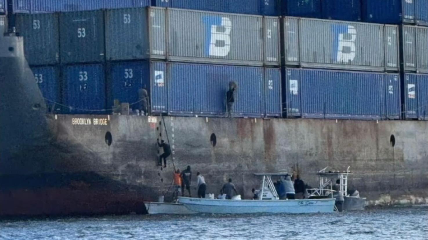 Grounded Container Ribs Looters left only 11 of 192 containers untouched on grounded barge ...