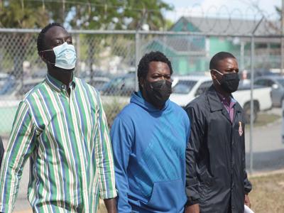 Trucker fined $7,000 in fake check scam; Another pleads not guilty