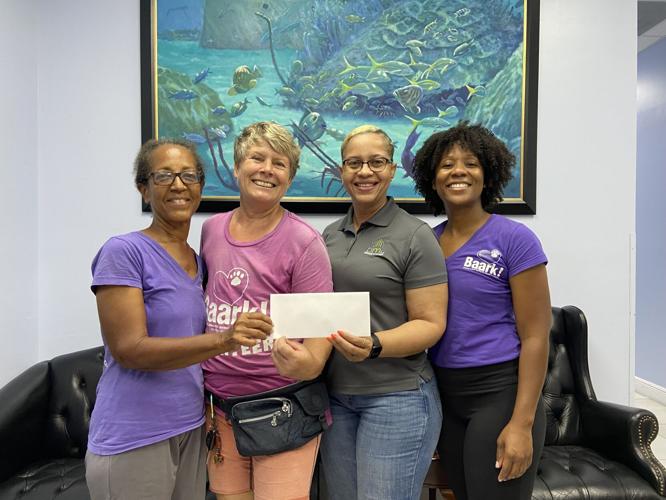 Cost Right Nassau & Freeport stores donate 4,500 to animal welfare