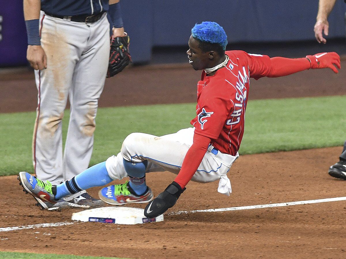 Miami Marlins' Jazz Chisholm Jr. wears camouflage socks on MLB Armed Force  Day honoring members of the U.S. military during the fifth inning of a  baseball game against the Atlanta Braves, Friday