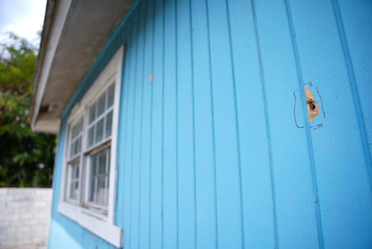 Woman killed by stray bullet while holding grandchild in home | News ...