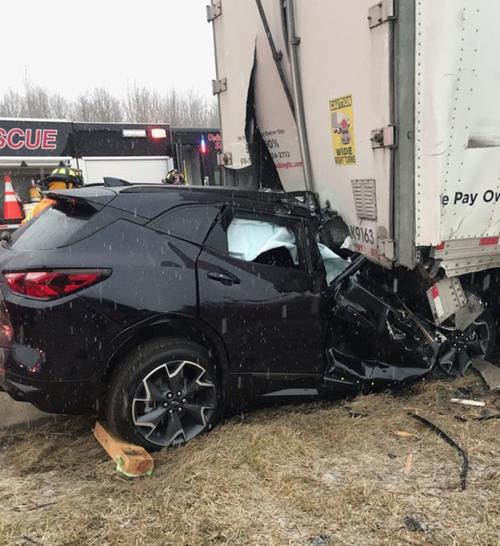 Driver killed when car strikes disabled semi
