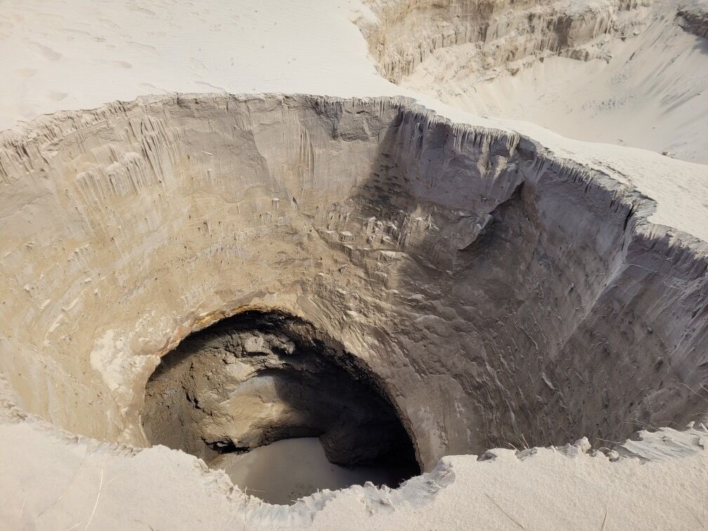 Trending / Photos / New Sinkhole: 'Cliffs can give way without