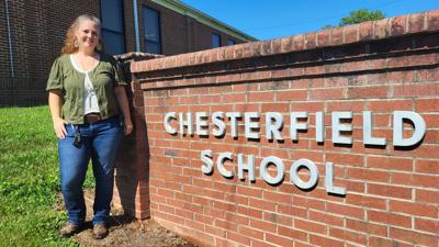 Kelly Michaels stands by Chesterfield Elementary sign