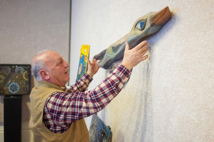 Bernard hangs art