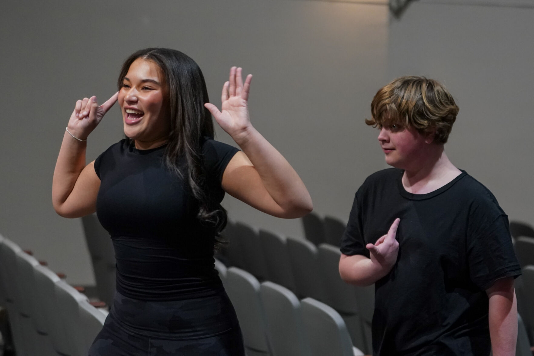 Zaida Yates (Dory) leads Marshall Johnson (Marlin) through the auditorium