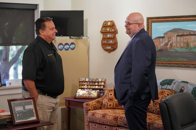 New Valdese Town Manager Todd Herms, right, talks with Chief of Police Marc Sharpe Tuesday at town hall.