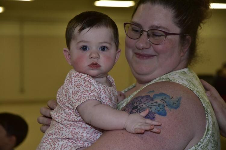 Amy Jenkins holds her daughter, Bella Jenkins, during last week's Catawba Valley Healthy Families event at the Foothills Higher Education Center.