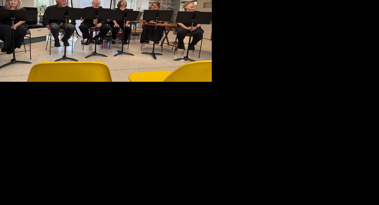 Members of the Burke Theater Guild sing "The Ballad of Tom Dooley (Dula)" during a performance Thursday at the Burke Museum of History's Coffee at the Museum program.