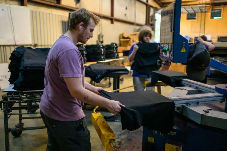 Worker places shirt