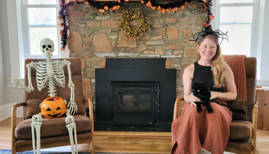 Ruthie Magnus with skeleton, Frank, and cat, Sebastian