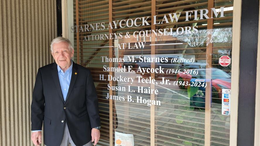 Tom Starnes stands outside the law firm