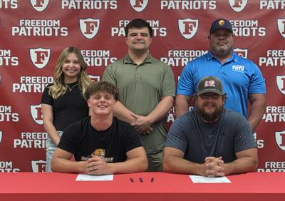 260425-sports-free-fball-signing-p1