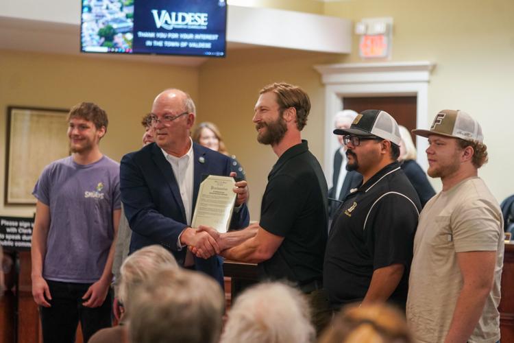 Valdese Mayor Huffman takes photo with Burke Brawl champions