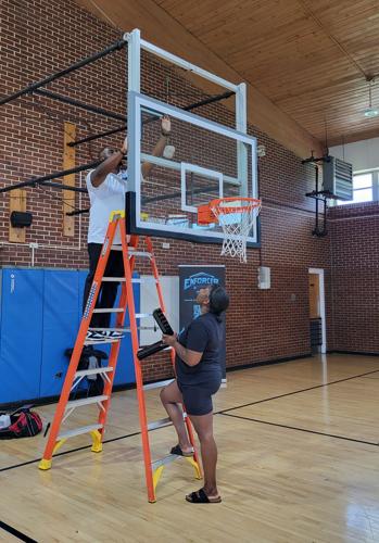 Dr. Demetrice and Shaunti Phillips install the Enforcer Whistle's visual component at NCSD
