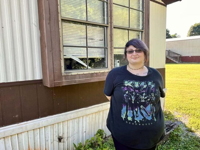 Victoria Frady in front of her mobile home at Idlewild Acres.jpg