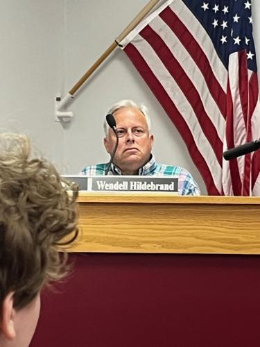 Hildebran Mayor Wendell Hildebrand listens to public comments during Monday's meeting of the town council.