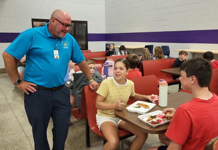 Mike Swan chats with Liberty Middle School students