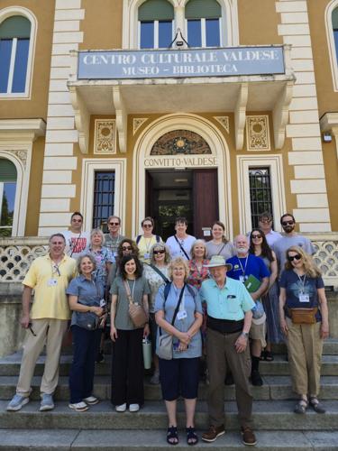 Group photo outside Torre Pellice Cultural Center