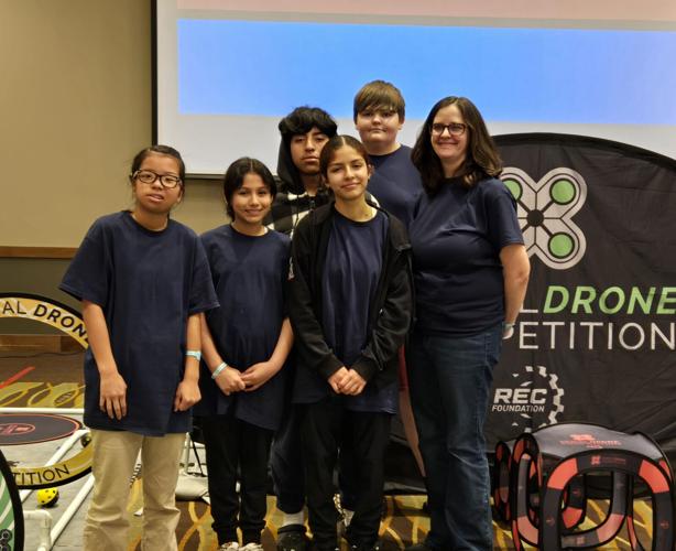 Middle and High school students (left to right: Anna Carpenter, Wendolyn Lopez, Kenia Cardoza, Coach Jennifer Willet, Daniel Mendoza, and Daniel Faust) from NCSDs robotics team participated in NRSC Aerial Drone Competition