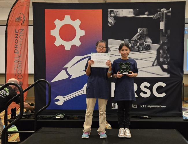 NCSDs middle school "Lady Bears" represented by Anna Carpenter (left) and Wendolyn Lopez (right) won the Judge Award for their teams dedication and acheivment.