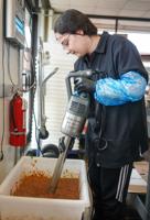 Sarah Ryan mixes vegetable at C2 Life earlier this week.