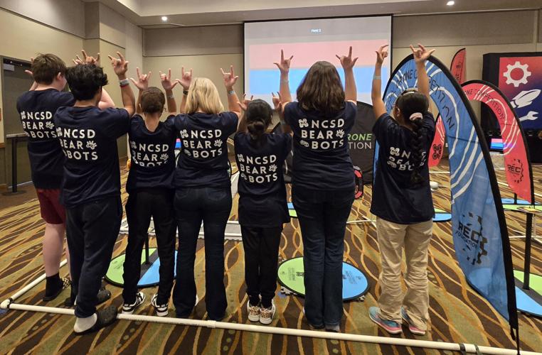 Students from NCSDs robotics team show off their spirit after competing in the NRSC Aerial Drone Competition.