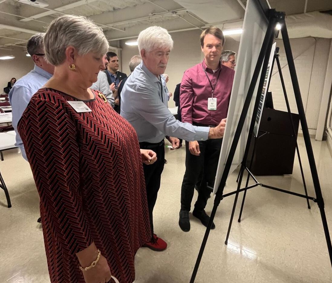 Morganton Mayor Ronnie Thompson points out an important issue involving recovery efforts from Hurricane Helene during a breakout session at Friday's meeting with FEMA officials. Morganton City Manager Sally Sandy looks on.
