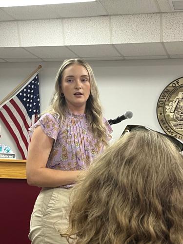 Town planner Katelyn Smith talks answers a question during her presentation at the Hildebran town council meeting Monday. Smith helped draft an ordinance that would place restrictions on cryptocurrency mining in the town.