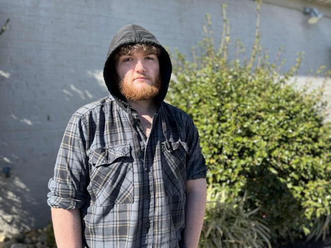 Chase Carswell standing in front of AJs Steakhouse.jpg