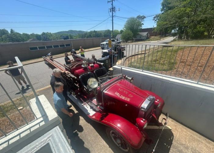 Valdese's first firetruck is rolled into the Waldensian Heritage Museum
