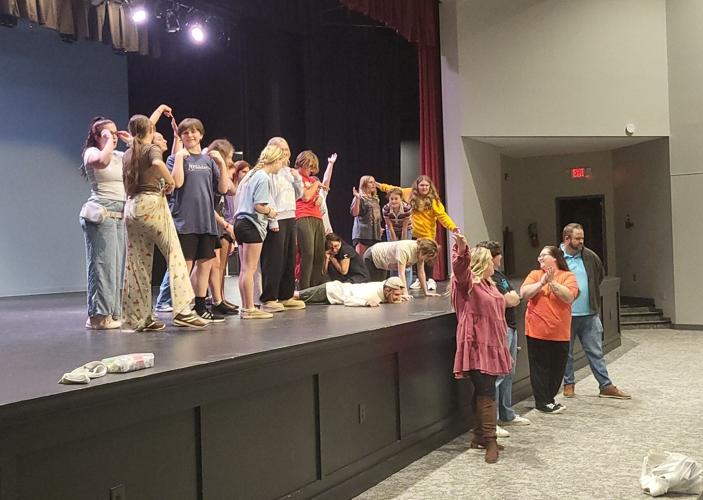 Performers pose at the end of 'Be Our Guest'